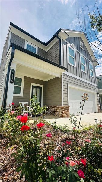 Front exterior of a new home in , Lilburn, GA, highlighting curb appeal (Image 22).