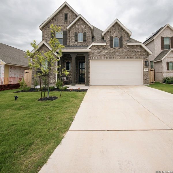 Front exterior of a new home in Davis Ranch, San Antonio, TX, highlighting curb appeal (Image 1). Front exterior of a new home in Davis Ranch, San Antonio, TX, highlighting curb appeal (Image 1).