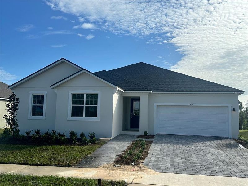 Front exterior of a new home in Rainwood, Clermont, FL, highlighting curb appeal (Image 2). Front exterior of a new home in Rainwood, Clermont, FL, highlighting curb appeal (Image 2).
