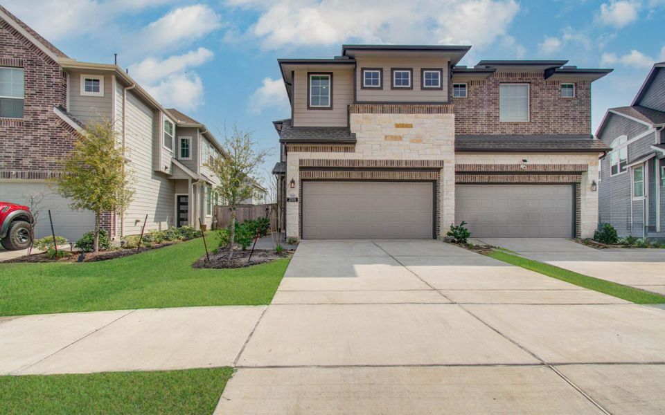 Front exterior of a new home in , Cypress, TX, highlighting curb appeal (Image 25).