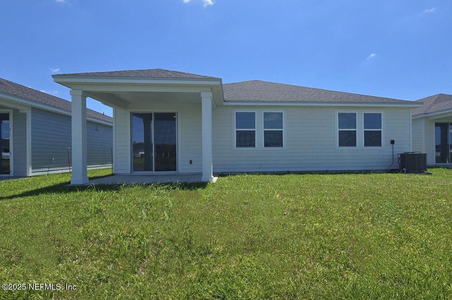 Front exterior of a new home in Lakes at Bella Lago - Signature Series, Green Cove Springs, FL, highlighting curb appeal (Image 18).