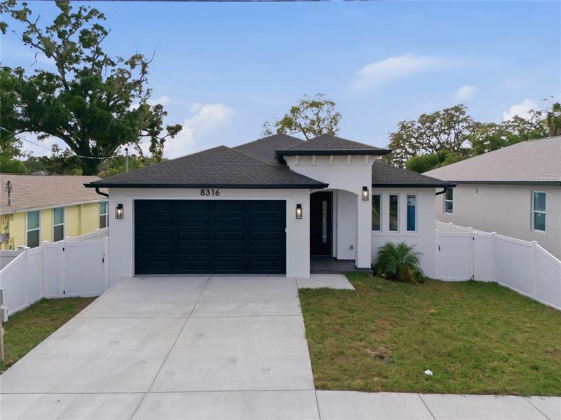 Front exterior of a new home in , Tampa, FL, highlighting curb appeal (Image 25).