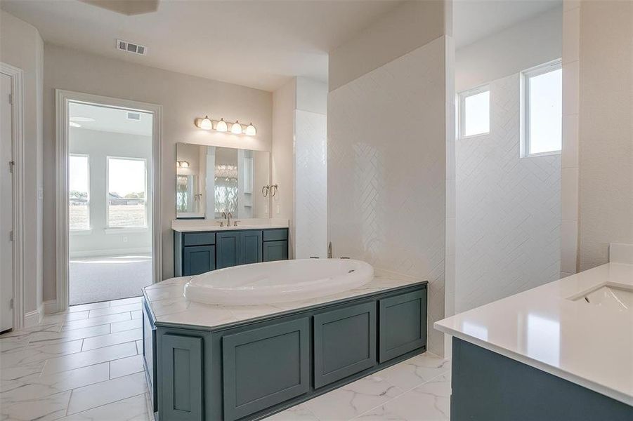 Bathroom with vanity and plenty of natural light