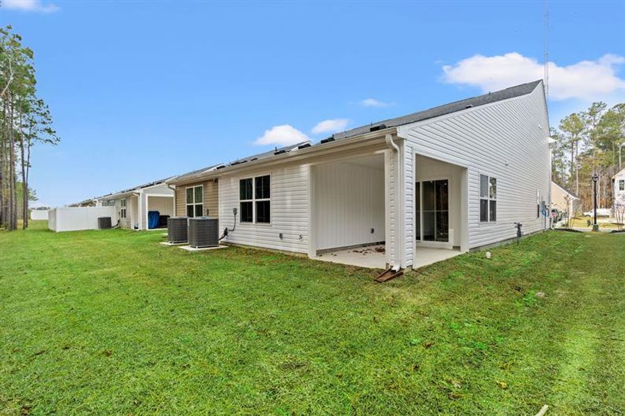 Exterior details and patio area of a home in Middle Creek Village Coastal Cottages & Villas, Bolivia (Image 2).