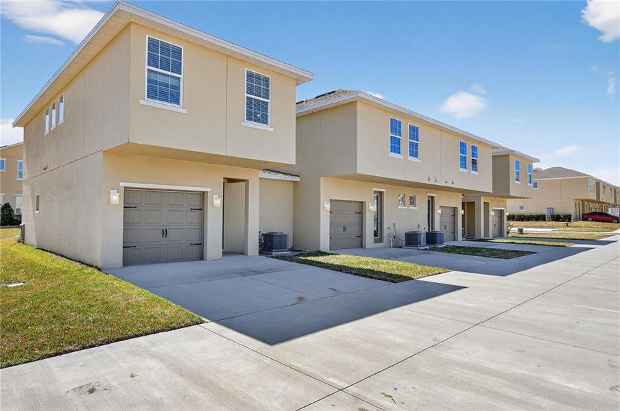 Front exterior of a new home in , Davenport, FL, highlighting curb appeal (Image 27).