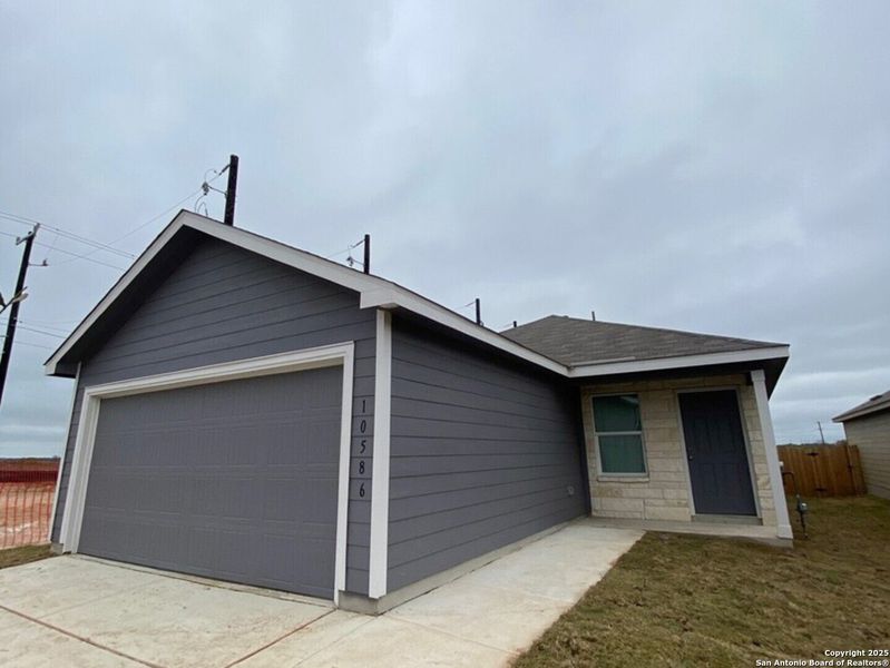 Front exterior of a new home in , Converse, TX, highlighting curb appeal (Image 1). Front exterior of a new home in , Converse, TX, highlighting curb appeal (Image 1).