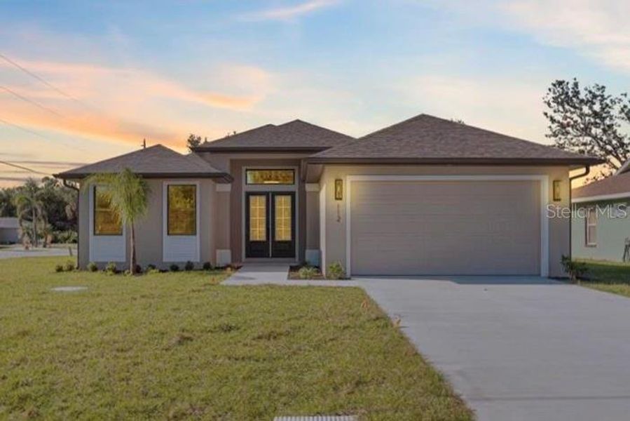 Front exterior of a new home in , Rotonda West, FL, highlighting curb appeal (Image 2).