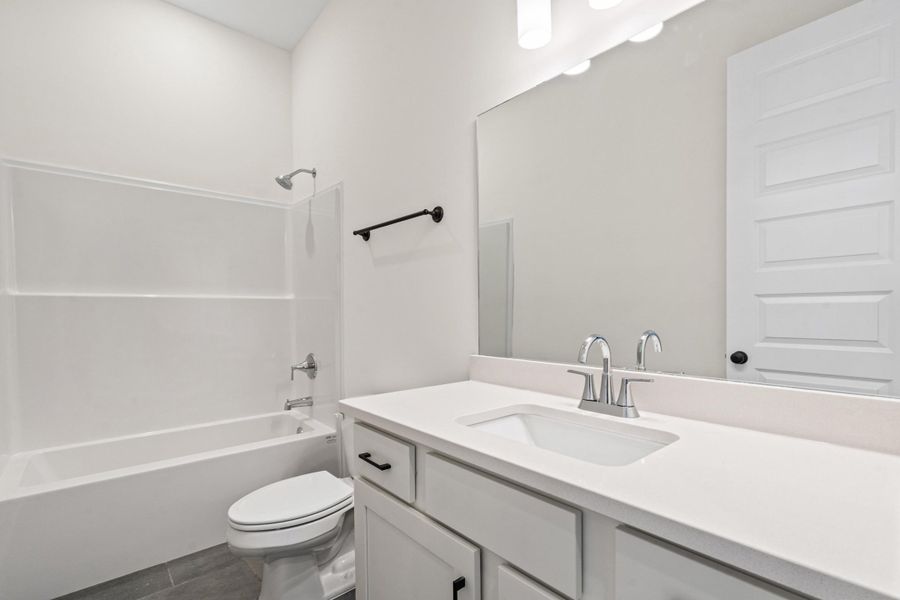 Bathroom featuring vanity and shower / washtub combination