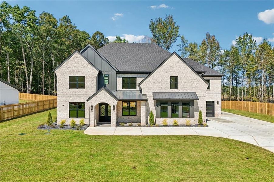 Front exterior of a new home in , Hoschton, GA, highlighting curb appeal (Image 31).