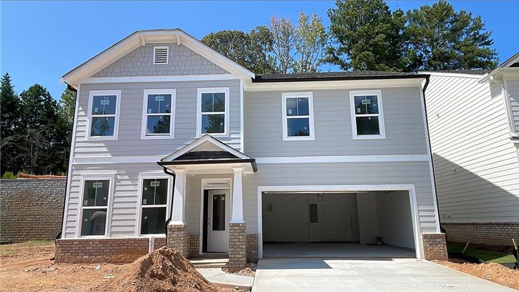 Front exterior of a new home in Edenglen, Buford, GA, highlighting curb appeal (Image 2).