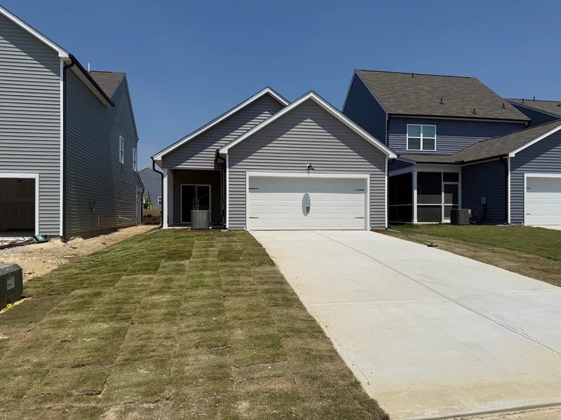 Front exterior of a new home in The Point, Rolesville, NC, highlighting curb appeal (Image 19). Front exterior of a new home in The Point, Rolesville, NC, highlighting curb appeal (Image 19).