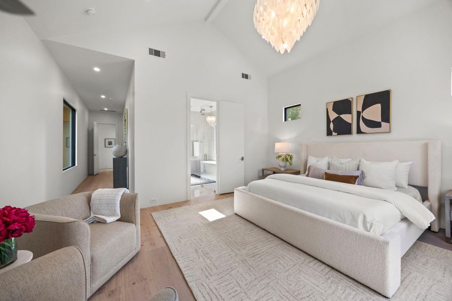 Primary Suite has a long entrance hallway before the bedroom.