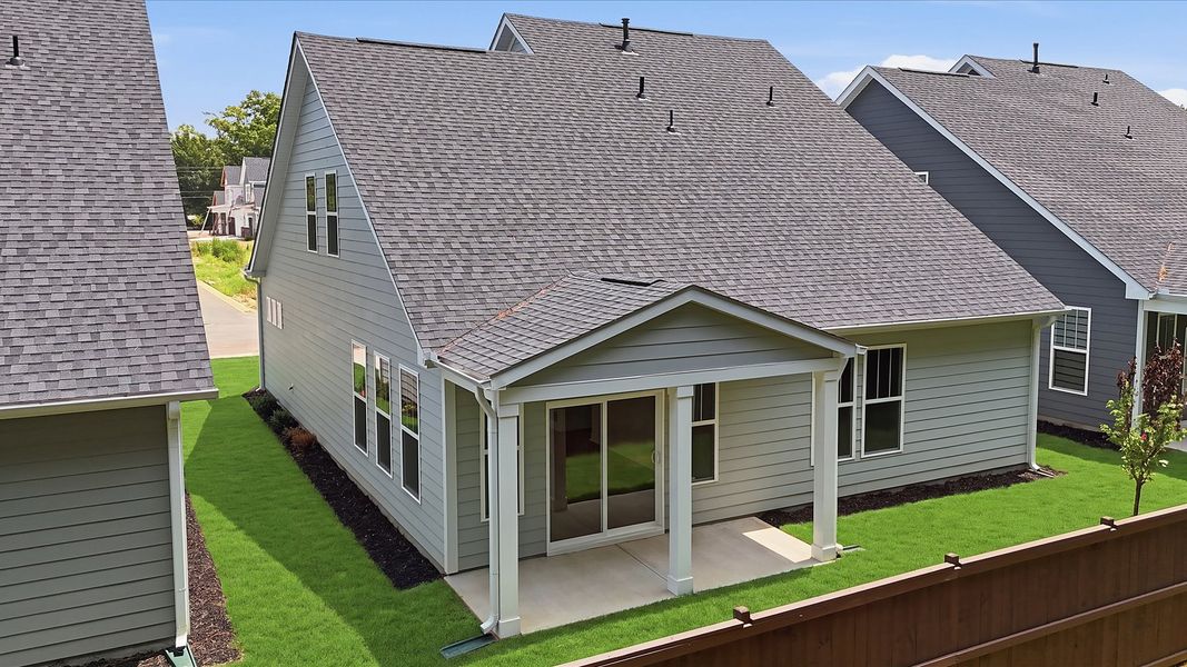 Thoughtfully designed rear exterior featuring a welcoming covered porch Thoughtfully designed rear exterior featuring a welcoming covered porch