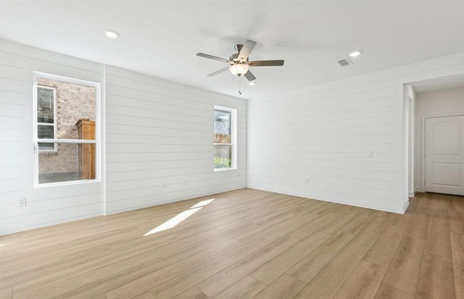 Gathering room featuring a stunning staircase as the focal point Gathering room featuring a stunning staircase as the focal point