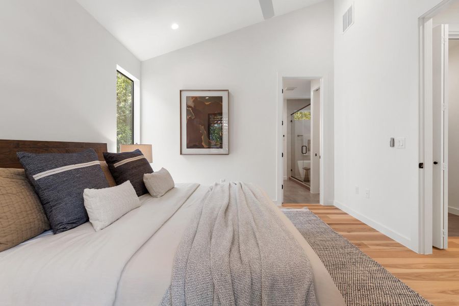 This comfortable primary retreat is thoughtfully separated from the home’s gathering spaces. This comfortable primary retreat is thoughtfully separated from the home’s gathering spaces.