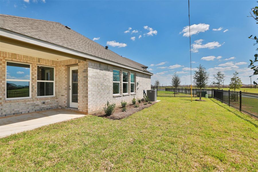 Exterior details and patio area of a home in Sunterra, Katy (Image 2). Exterior details and patio area of a home in Sunterra, Katy (Image 2).