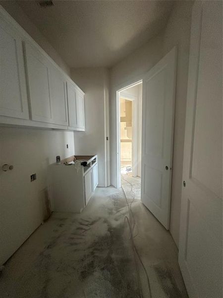 Utility room conveniently connects to primary closet