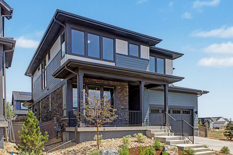 Front exterior of a new home in West Grange, Longmont, CO, highlighting curb appeal (Image 19). Front exterior of a new home in West Grange, Longmont, CO, highlighting curb appeal (Image 19).