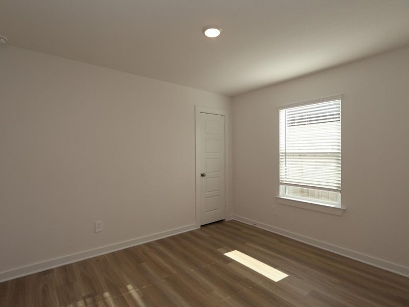 Spacious, unfurnished interior of a new home in Pinewood at Grand Texas, New Caney (Image 13).