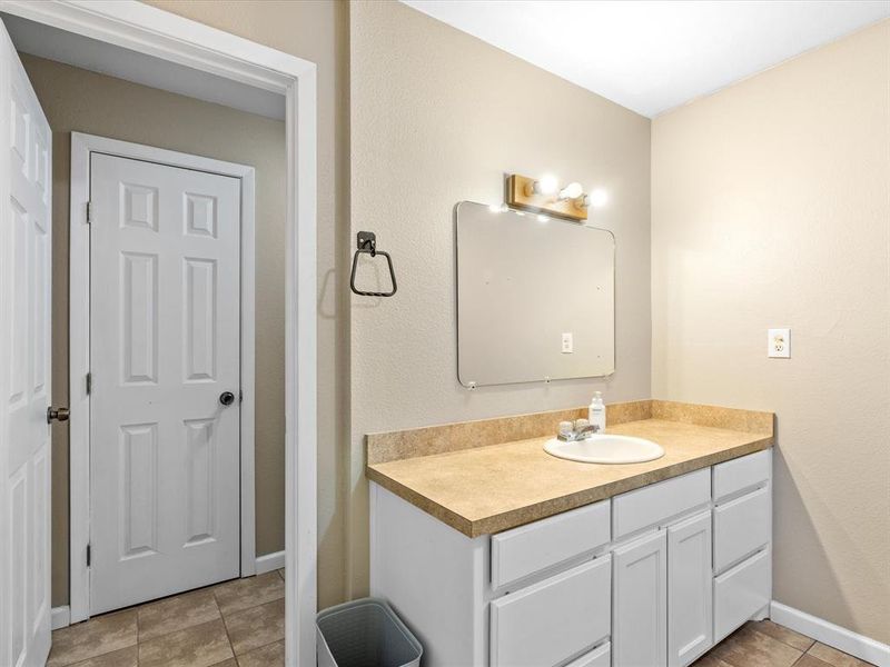 Bathroom with vanity and tile patterned flooring Bathroom with vanity and tile patterned flooring