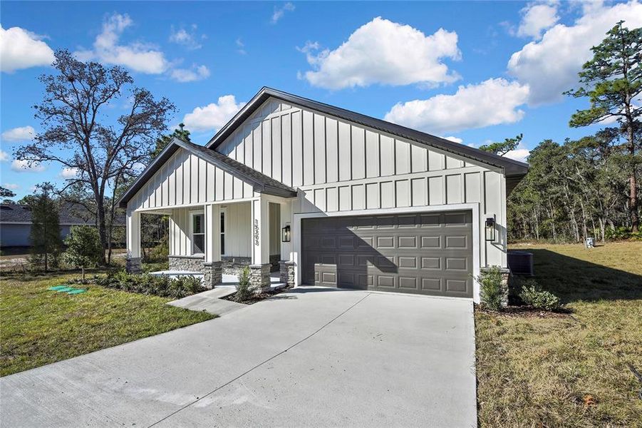 Front exterior of a new home in , Brooksville, FL, highlighting curb appeal (Image 25).