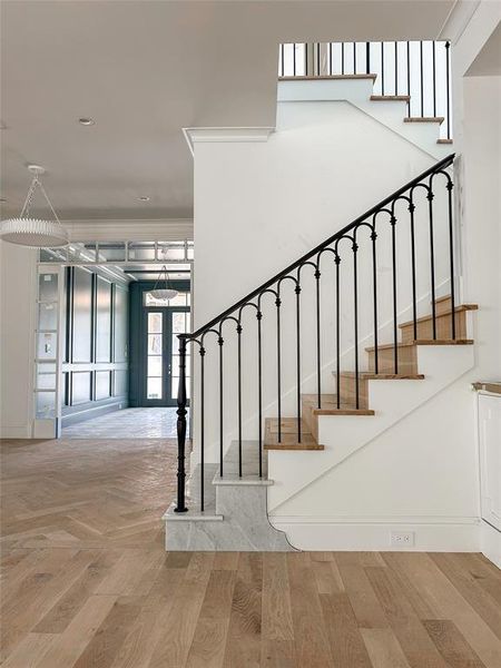 Custom stair rail with marble starter steps Custom stair rail with marble starter steps