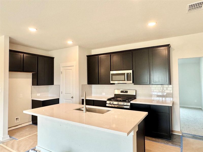 Furnished interior view inside a new home in Carillon, Manor (Image 6).