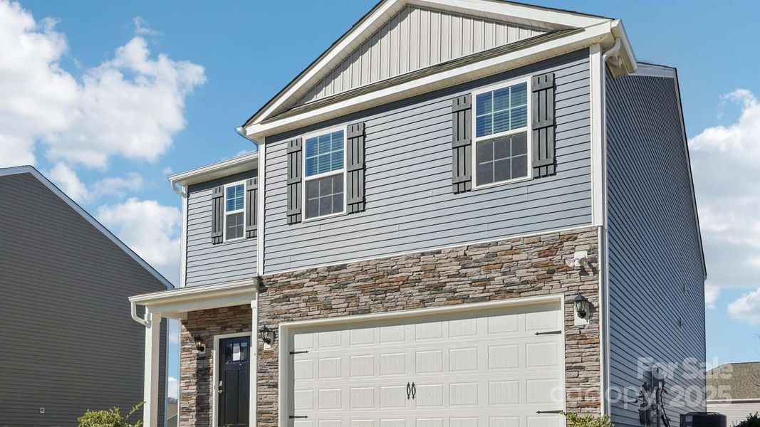 Front exterior of a new home in Wallace Springs, Statesville, NC, highlighting curb appeal (Image 18). Front exterior of a new home in Wallace Springs, Statesville, NC, highlighting curb appeal (Image 18).