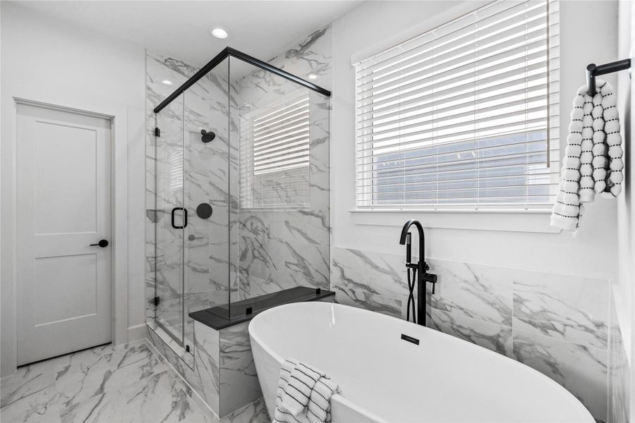 Enjoy both a spa-style soaking tub and a stand-up shower for added comfort and relaxation. Whether you want a long, peaceful soak at the end of the day or a quick, refreshing rinse in the morning, this bathroom gives you options that fit every routine.