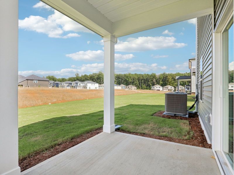 Covered patio in the Paisley floorplan at a Meritage Homes community in Garner, NC.