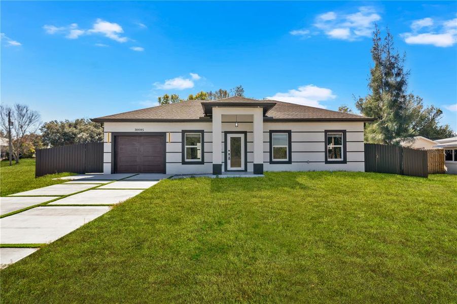 Front exterior of a new home in , Punta Gorda, FL, highlighting curb appeal (Image 23).