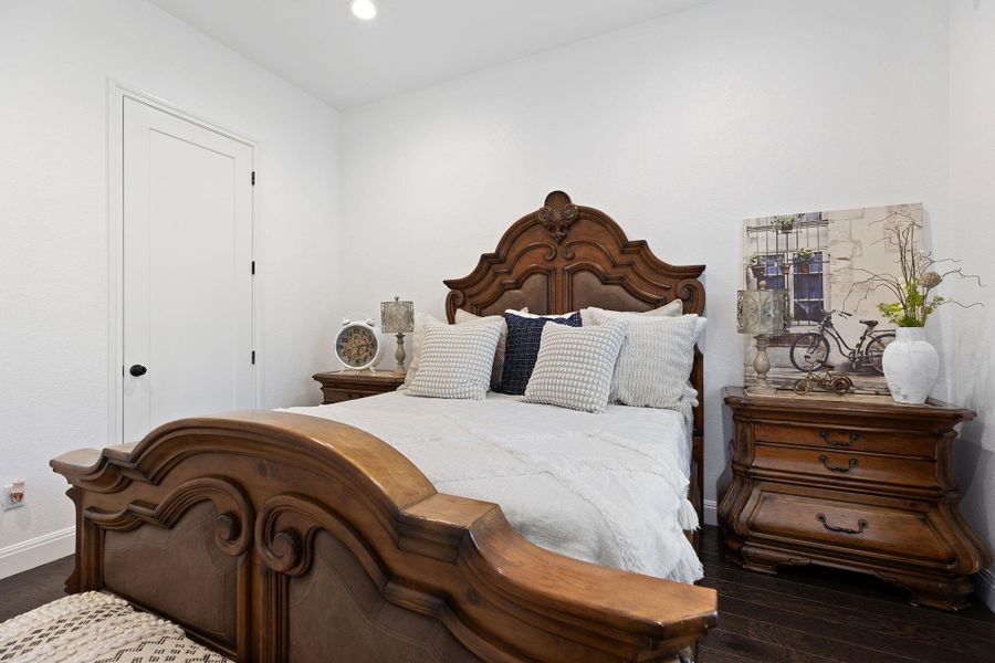 Bedroom featuring dark wood-type flooring and recessed lighting Bedroom featuring dark wood-type flooring and recessed lighting