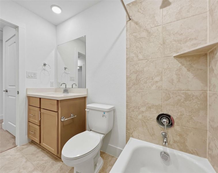Full bathroom featuring vanity and shower / washtub combination