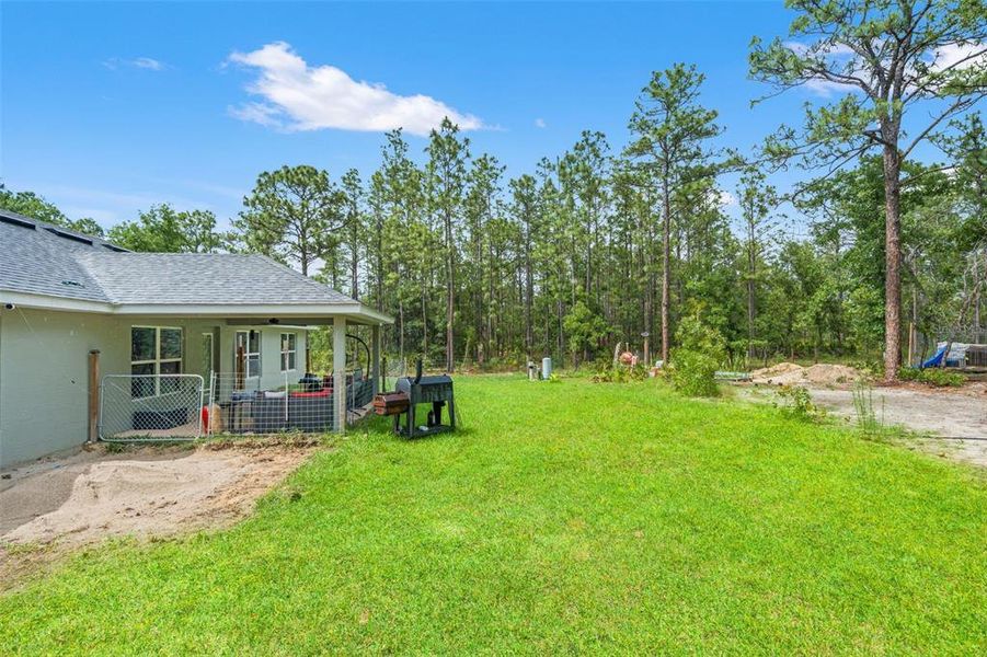 Exterior details and patio area of a home in Royal Highlands, Brooksville (Image 23).