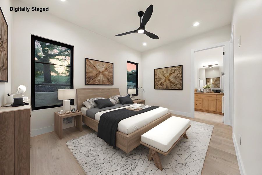 A tranquil bedroom retreat features clean lines, light wood tones, and generous windows framing the natural outdoor landscape.