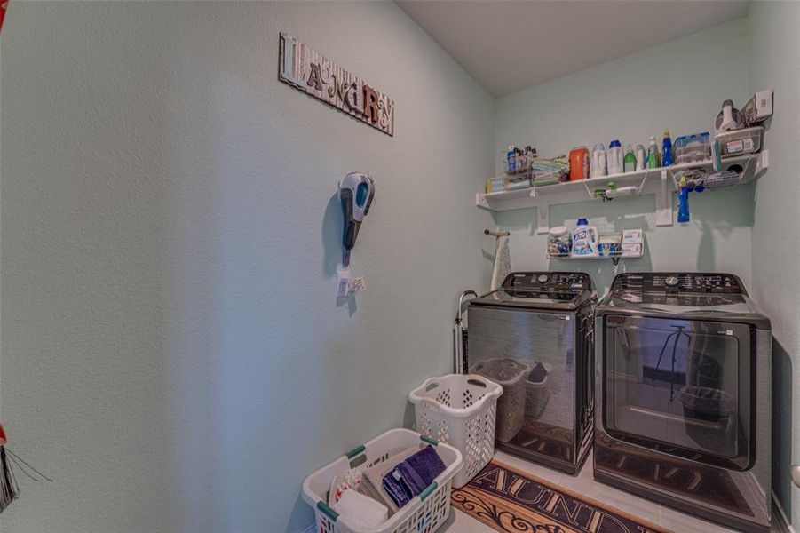 Laundry area with washing machine and clothes dryer