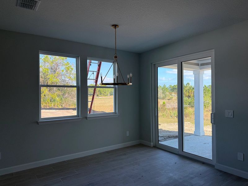 Sun-filled dining space with easy access to back patio