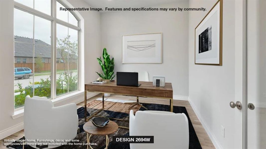 Office area with hardwood / wood-style floors