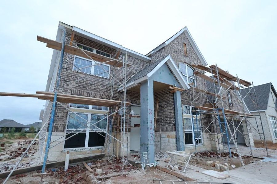 Front exterior of a new home in Oakwood Estates, Waller, TX, highlighting curb appeal (Image 1). Front exterior of a new home in Oakwood Estates, Waller, TX, highlighting curb appeal (Image 1).