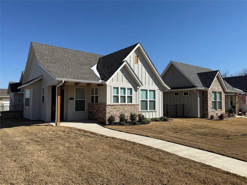 Front exterior of a new home in , Granbury, TX, highlighting curb appeal (Image 2). Front exterior of a new home in , Granbury, TX, highlighting curb appeal (Image 2).