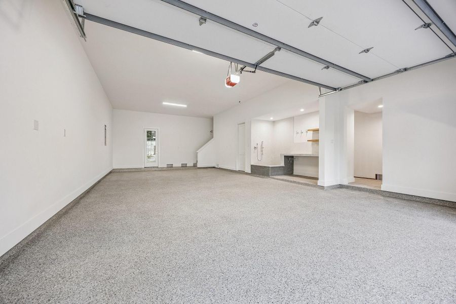 Incredible Four Car Garage with an Epoxy Treated Floor, plus extra storage and access to the elevator shaft. The Garage is also Pre-Wired for Two 220V Outlets. Incredible Four Car Garage with an Epoxy Treated Floor, plus extra storage and access to the elevator shaft. The Garage is also Pre-Wired for Two 220V Outlets.