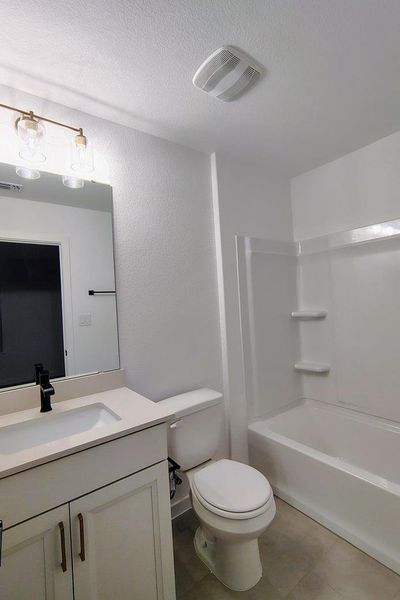 Furnished interior view inside a new home in Wolf Ranch, Georgetown (Image 10).