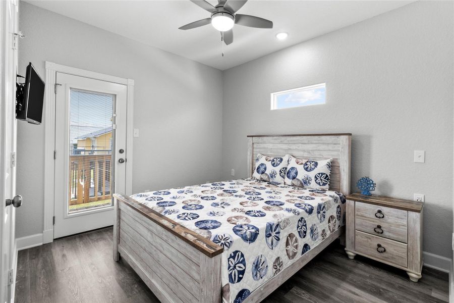 Downstairs Bedroom with Rear Balcony Access