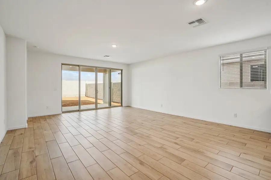 Great room with upgraded 4 panel slider. Colors and finishes may vary by community.