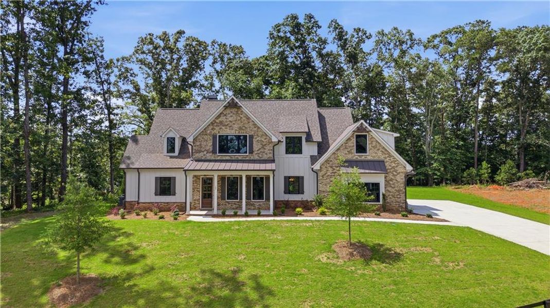 Front exterior of a new home in , Canton, GA, highlighting curb appeal (Image 1). Front exterior of a new home in , Canton, GA, highlighting curb appeal (Image 1).