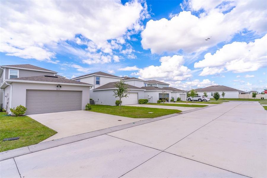 Front exterior of a new home in , St. Cloud, FL, highlighting curb appeal (Image 31).