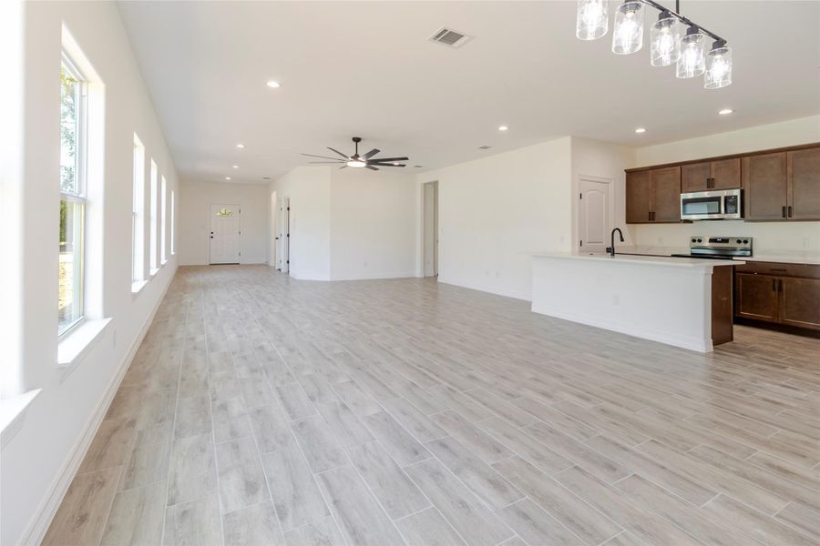 Wide-plank, wood-look tile runs throughout the entire home, no carpet and no mixture of flooring from room to room. Wide-plank, wood-look tile runs throughout the entire home, no carpet and no mixture of flooring from room to room.