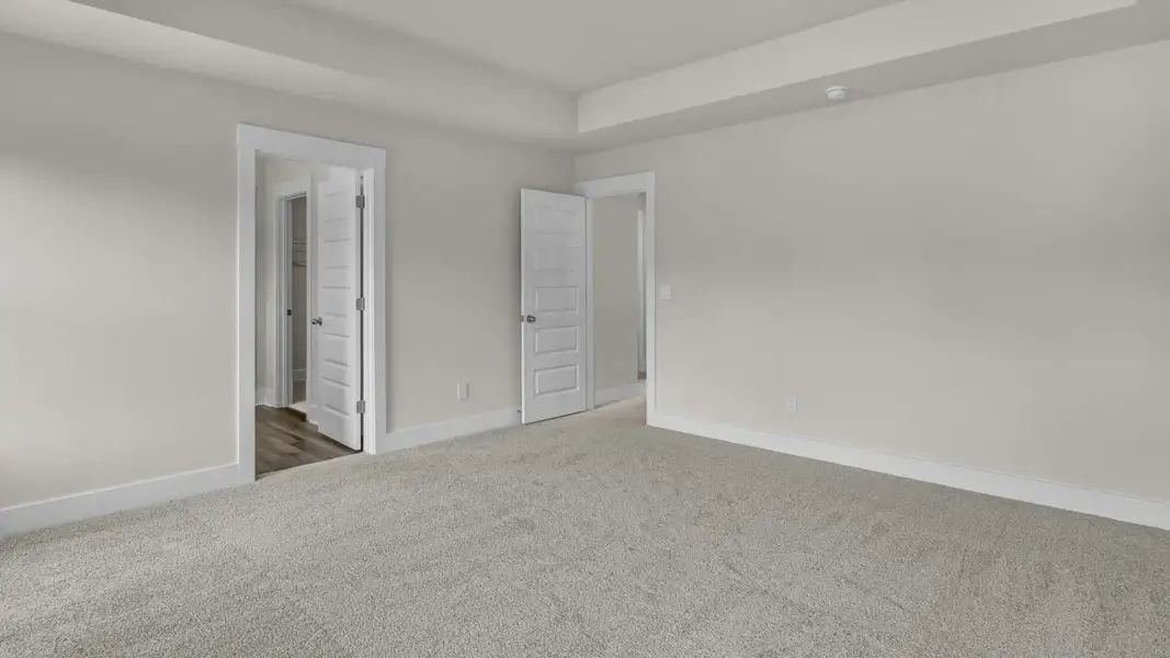 Representative unfurnished interior of a home built from the Forrester by D.R. Horton in The Highlands at Cedar Hill Landing, Navassa (Image 28).