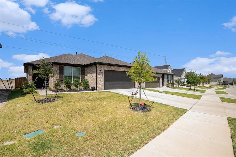 Front exterior of a new home in , Godley, TX, highlighting curb appeal (Image 1). Front exterior of a new home in , Godley, TX, highlighting curb appeal (Image 1).