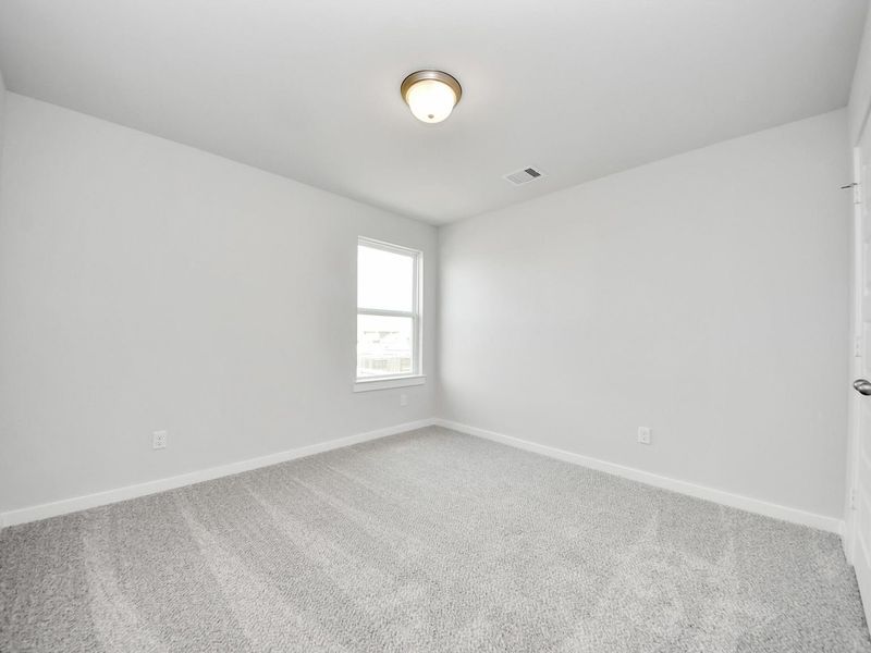 Spacious, unfurnished interior of a new home in Sunterra, Katy (Image 26).